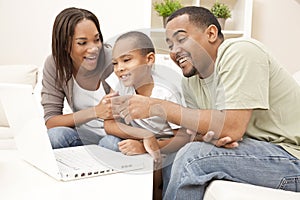 African American Family Using Laptop Computer