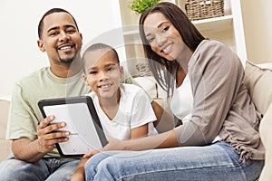 African American Family Using Tablet Computer