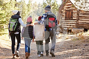 African American Family Walking Through Fall Woodland