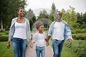 African american family walking in park