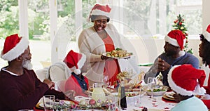 African american family wearing santa hats