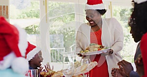 African american family wearing santa hats