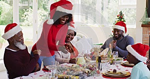 African american family wearing santa hats