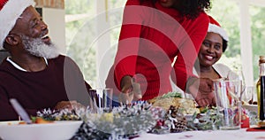 African american family wearing santa hats