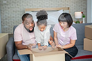 African American father, Asian mother and 5-year-old daughter, they are happy together From moving or relocation