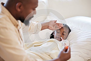 African american father checking his sick daughters temperature while taking care of her at home. Little girl sleeping