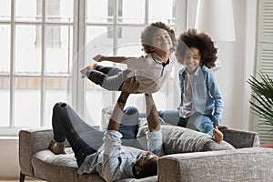 African American father playing funny active sport games