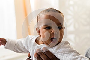 African American Father Playing With mixed race Baby Son