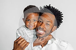 African American Father and Son Hug For A Portrait