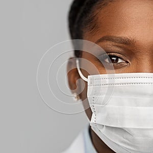 African american female doctor in facial mask