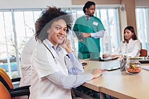 African american female doctor on hospital looking at camera smiling
