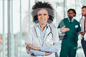 African american female doctor on hospital looking at camera smiling