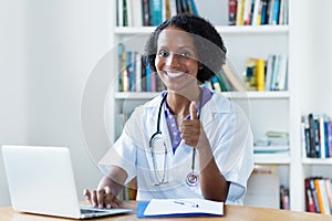 African american female doctor recommending distance and stay at home