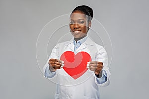 African american female doctor with red heart