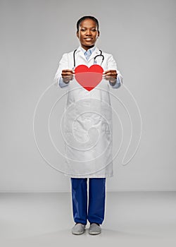 African american female doctor with red heart