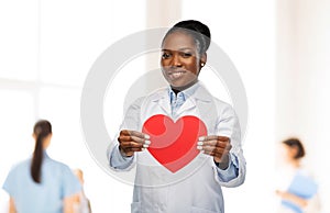 African american female doctor with red heart