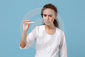 African american female doctor woman in white medical gown holding clinical thermometer isolated on blue background