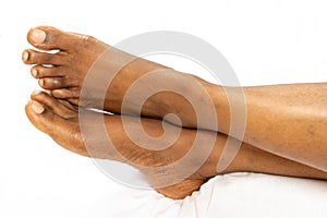 African American female feet legs heel of foot isolated on a white background for medicine beauty relaxation and spa, health