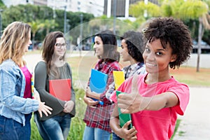 African american female student with group of international stud