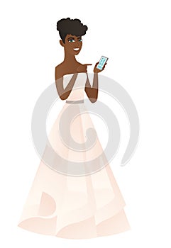 African-american fiancee holding a mobile phone.