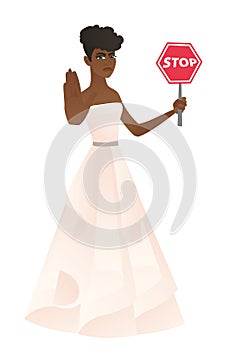 African-american fiancee holding stop road sign.