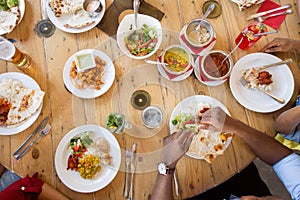 African american friends eating at restaurant