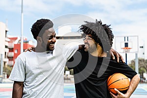 African American friends playing basketball outdoor