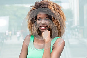 African american girl with amazing hairstyle in the city