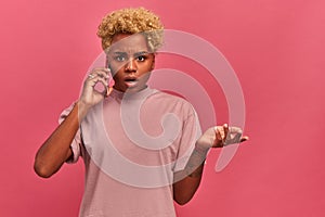 African-American girl does not understand what she is being told on the phone.