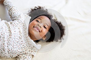 African american girl kid smile portrait in bedroom at home.