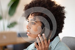 African American girl making phone call looking worried