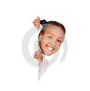 African-american girl peeking out from empty banner