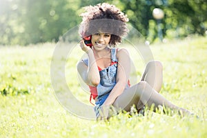 African american girl relaxing outdoor with headphones. photo