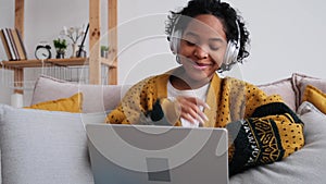 African american girl using laptop computer having video chat at home. Young woman having virtual meeting online chat