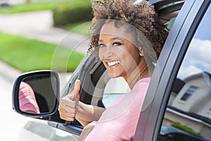 African American Girl Woman Thumbs Up Driving Car photo