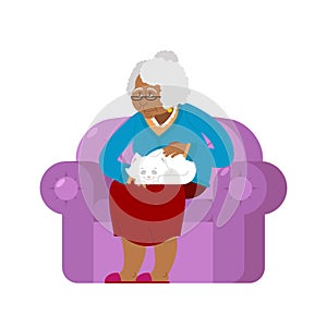 African American Grandmother and cat sitting on chair. granny ca