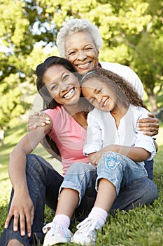 African American Grandmother, Mother And Daughter Relaxing In Pa