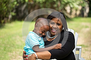 Grandmother hugging her grandson.