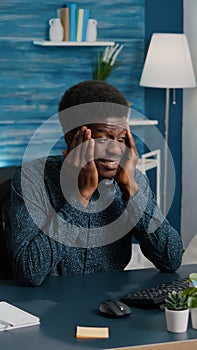 African american guy stressing, having a big headache