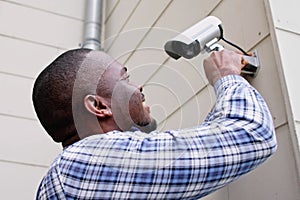 African American Handyman With CCTV Camera