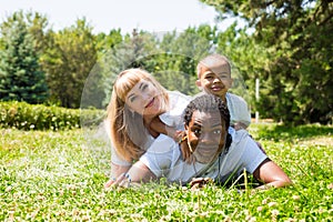 African American happy family: black father, mom and baby boy on nature. Use it for a child, parenting or love concept