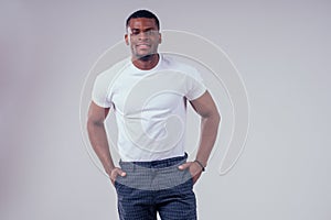 African American healthy male model in a cotton white t-shirt in studio summer lifestyle