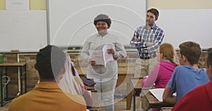 African American high school girl speaking to a group of teenagers