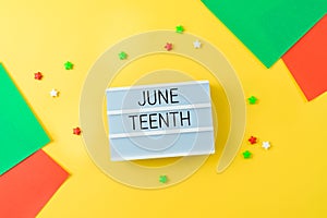 African American holiday Juneteenth background with lightbox and colorful bright paper