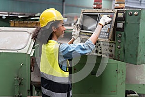 african american Industry engineer woman inspect control cabinet machine in industrial factory . black female mechanical