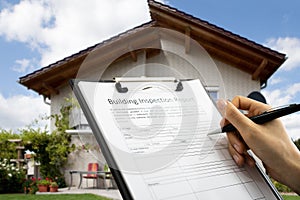 African American Inspector Checking Building Report