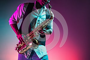 African American jazz musician playing the saxophone.