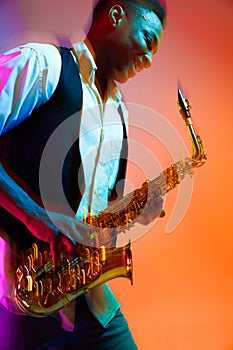 African American jazz musician playing the saxophone.