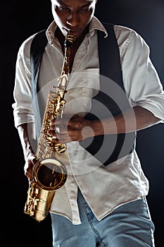 African American jazz musician playing the saxophone.