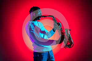 African American jazz musician playing the saxophone.